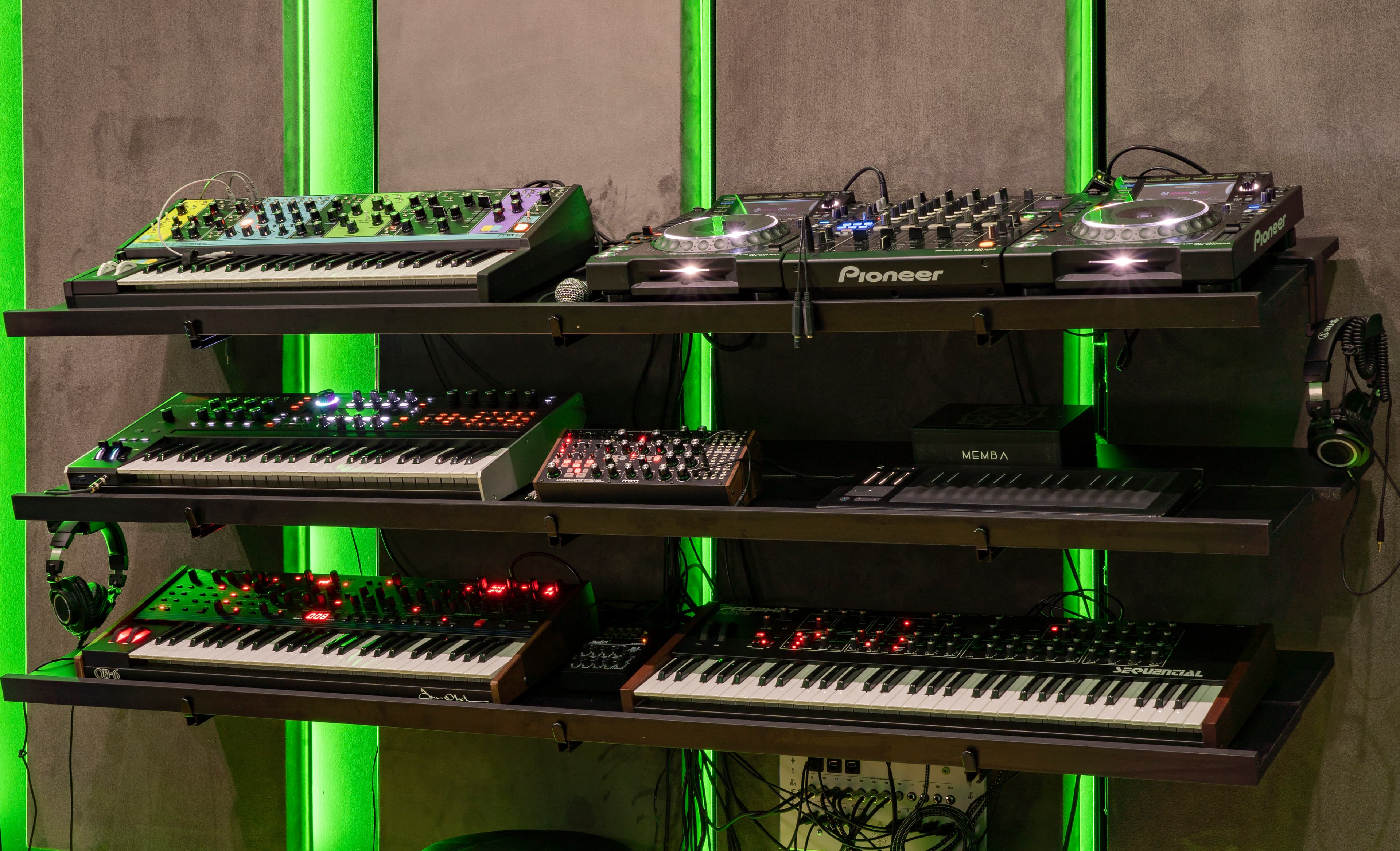 Synth rack and CDJs at Antenna Studios